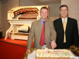 International Organist Simon Gledhill cuts the cake at the 25th anniversary concert  Karrinyup